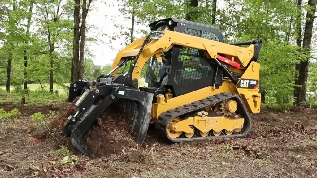 AccuDirt compact track loader with grapple bucket